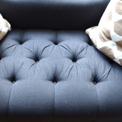 tufted settee in black linen
